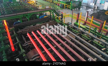 HUZHOU, CHINA - OCTOBER 28, 2024 - A worker works in a workshop of Zhejiang Minghe Steel Pipe Co., LTD., located in Moganshan High-tech Zone in Huzhou Stock Photo