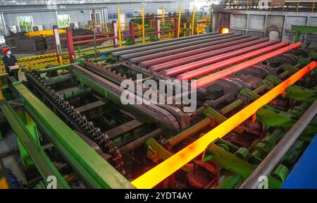 HUZHOU, CHINA - OCTOBER 28, 2024 - A worker works in a workshop of Zhejiang Minghe Steel Pipe Co., LTD., located in Moganshan High-tech Zone in Huzhou Stock Photo