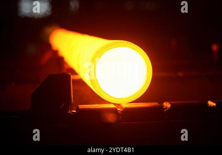 HUZHOU, CHINA - OCTOBER 28, 2024 - A steel pipe is baked on the heat treatment production line of Zhejiang Minghe Steel Pipe Co., Ltd. in Moganshan Hi Stock Photo