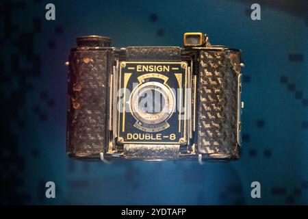 A vintage Ensign Double-8 camera displayed in a museum exhibit. Stock Photo