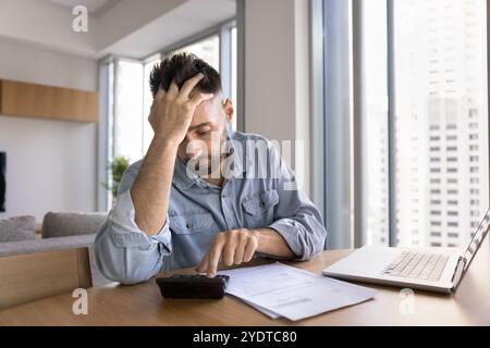 Worried tired freelance businessman getting financial problems Stock Photo