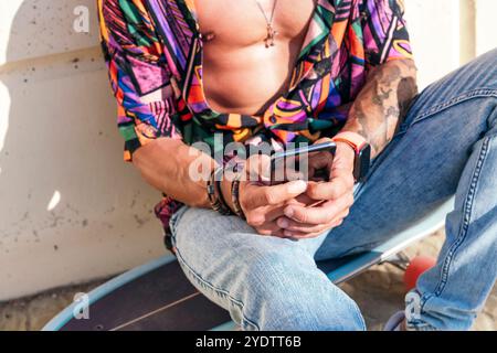 unrecognizable hipster chatting on social media Stock Photo