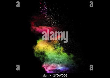 Explosion of colorful Holi powder on black background. Vibrant color dust particles textured background Stock Photo