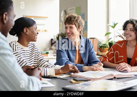 Discussing Project Ideas in Modern Office Setting Stock Photo