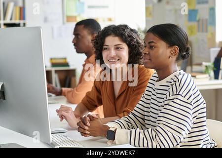 Collaborating in Modern Office Environment with Computers Stock Photo