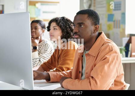 Collaborating on Project in Modern Office Environment Stock Photo