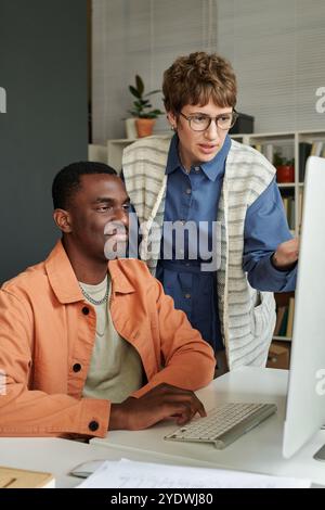 Collaborating on Project in Modern Office Setting Stock Photo