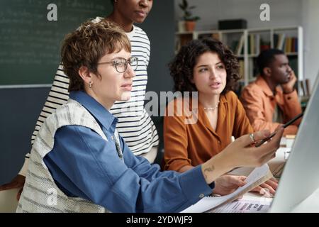 Collaborating on New Project in Modern Office Setting Stock Photo