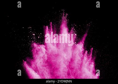 Pink powder explosion on white background. Pink dust splashing. Launched colorful particles on background Stock Photo