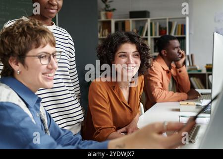 Group Collaborating in Modern Office Setting Stock Photo