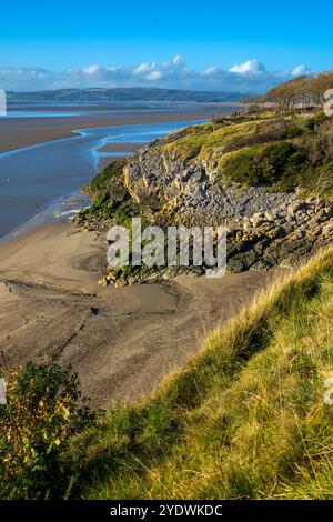 Rugged cliffs on the Jack Scout area of coast at Silverdale on Morecambe Bay. Seen at the point where the river Kent flows into the bay. Stock Photo