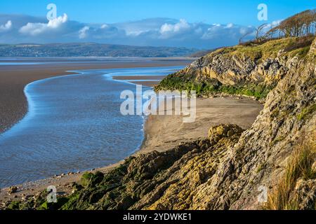 Rugged cliffs on the Jack Scout area of coast at Silverdale on Morecambe Bay. Seen at the point where the river Kent flows into the bay. Stock Photo