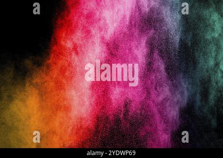 Abstract multi color powder explosion on black background. Freeze motion of color dust particles splash. Painted Holi in festival Stock Photo