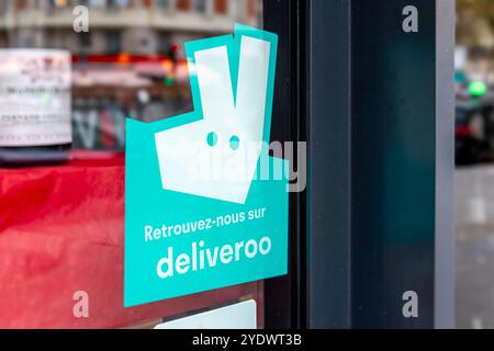 Sticker on the window of a restaurant partnered with Deliveroo, an online food ordering and delivery platform, Paris, France Stock Photo