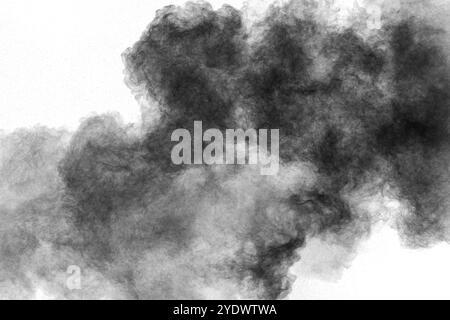 Black powder explosion against white background.Charcoal dust particles cloud Stock Photo