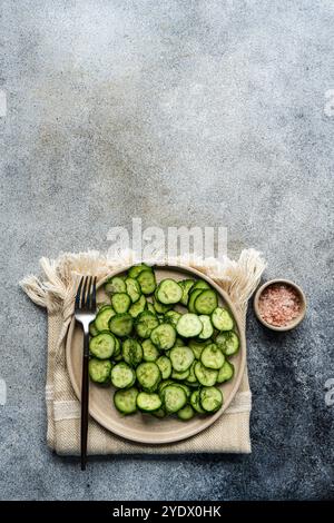 Overhead view of a plate of cucumber salad with dill and olive oil Stock Photo