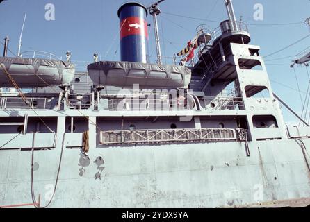 San Pedro, CA. USA. 1983. Lane Victory was built in Los Angeles by the California Shipbuilding Corporation and launched on May 31, 1945. On her first voyage, June 27, 1945, Lane Victory carried war supplies in the Pacific. The War Shipping Administration gave the operations of the ship to the American President Lines. United States Merchant Mariners operated the ship. The United States Navy Armed Guard, who manned the ship's guns, worked as signalmen and radiomen. She made two Pacific cruises, beginning July 10, 1945, to Manus Island, and the second starting August 30, 1945, to Guam, Saipan Stock Photo