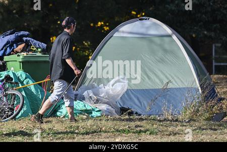 Montreal, Canada. 25th Oct, 2024. A man walks through a homeless encampment on Notre-Dame street in the east end of Montreal, Friday, Oct. 25, 2024. Credit: The Canadian Press/Ģ����ý Live News Stock Photo