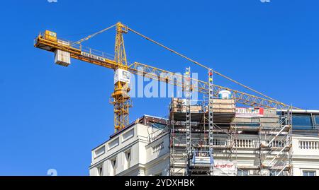Liebherr construction crane operating on building in Vienna, Austria. Stock Photo