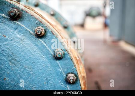 Sealing connection bolted screw connection, on manhole of industrial machine compressor or pump on chemical plant selective focus with out of focus ab Stock Photo