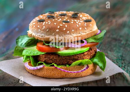 Gourmet burger close up with several foods inside. Vegetarian burger with soy and wheat steak 016360 031 Stock Photo