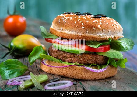 Gourmet burger close up with several foods inside. Vegetarian burger with soy and wheat steak 016360 032 Stock Photo
