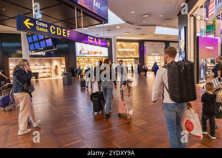 Copenhagen Airport with tax-free shops and gate signs. Copenhagen, Denmark - October 25, 2024 Stock Photo