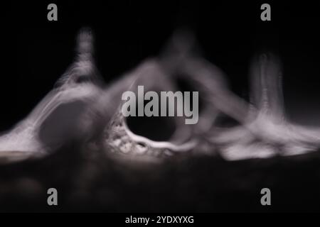Silver liquid connections, bubble in macro, movement of liquid in a bubble, abstract background, surrealistic flow Stock Photo