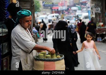 The historic Bab Al- Musa market in the Yemeni city of Taiz becomes very busy with residents shopping during Ramadan. The construction of the market of Bab Musa and the walls of the old city dates back to the Ottoman era in Yemen, with the market developing with the construction of the Bab Al-Musa Gate in the eighth century. Taiz remained a walled city until 1948 when Imam Ahmed allowed for expansion beyond its fortified wall. Taiz, which is located in south-western Yemen, is the third largest city in Yemen, and was its cultural capital until before becoming deeply entangled in the Yemeni conf Stock Photo