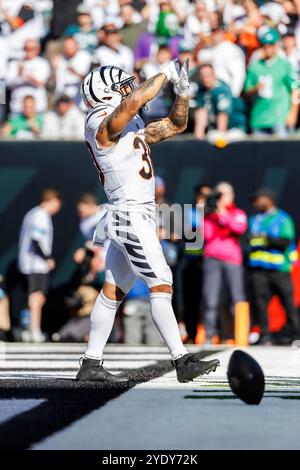 Commandres Running Back Cincinnati Bengals running back Chase Brown (30) is tackled by Miami ...
