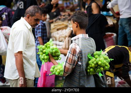 The historic Bab Al- Musa market in the Yemeni city of Taiz becomes very busy with residents shopping during Ramadan. The construction of the market of Bab Musa and the walls of the old city dates back to the Ottoman era in Yemen, with the market developing with the construction of the Bab Al-Musa Gate in the eighth century. Taiz remained a walled city until 1948 when Imam Ahmed allowed for expansion beyond its fortified wall. Taiz, which is located in south-western Yemen, is the third largest city in Yemen, and was its cultural capital until before becoming deeply entangled in the Yemeni conf Stock Photo