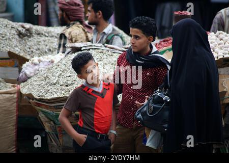 The historic Bab Al- Musa market in the Yemeni city of Taiz becomes very busy with residents shopping during Ramadan. The construction of the market of Bab Musa and the walls of the old city dates back to the Ottoman era in Yemen, with the market developing with the construction of the Bab Al-Musa Gate in the eighth century. Taiz remained a walled city until 1948 when Imam Ahmed allowed for expansion beyond its fortified wall. Taiz, which is located in south-western Yemen, is the third largest city in Yemen, and was its cultural capital until before becoming deeply entangled in the Yemeni conf Stock Photo