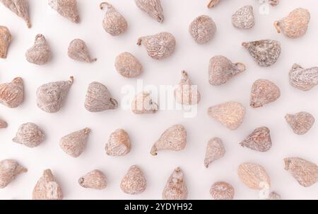 dried baby figs isolated on white background with clipping path, pattern of whole figs close-up Stock Photo