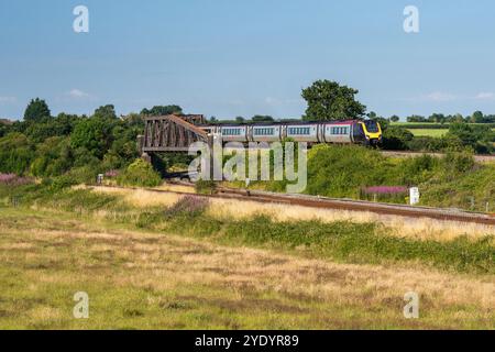 A CrossCountry Voyager passenger train crosses the Reading-Taunton Line on the Bristol-Exeter Railway at Cogload Junction in Somerset, England. Stock Photo