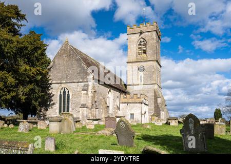 Sun shines on the tower of the traditional parish church of St Laurence in Longney, Gloucestershire. Stock Photo