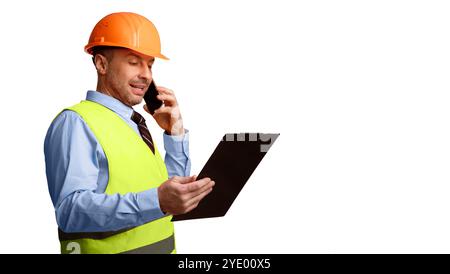 Builder In Uniform Talking On Phone Standing On White Background Stock Photo