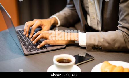 Cropped image of busy guy using computer Stock Photo