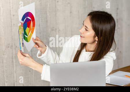 Remote work concept. Designer demonstrates color swatch Stock Photo