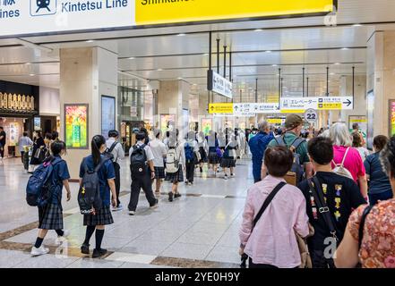 Large group of Japanese schoolchildren inside Osaka railway station, Japan on 27 September 2024 Stock Photo