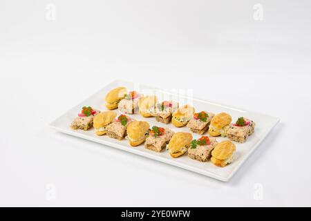 Egg salad and tuna salad finger sandwiches on a platter Stock Photo