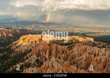 Panoramic view of the Bryce Canyon as seen from the Bryce Point before the sunset with a rainbow in the background Stock Photo