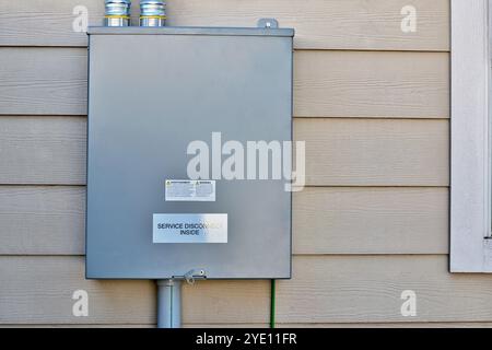 Standby generator transfer switch disconnect box junction wall residential. Stock Photo