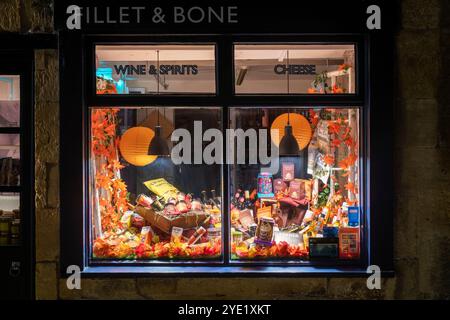 Fillet and Bone shop autumn display at night. Chipping Campden, Cotswolds, Gloucestershire, England Stock Photo