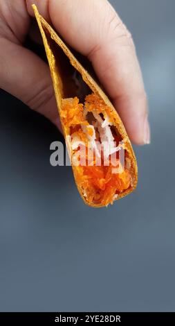 New Style of Thai Crispy pancake crepes in square shape cut, filled with coconut cream, Thai sweetmeat, shredded coconut, strips of egg yolks Stock Photo