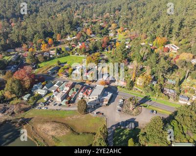 Aerial view of a small country town with coloured Autumn trees at Warburton in the Yarra Valley in Victoria, Australia Stock Photo