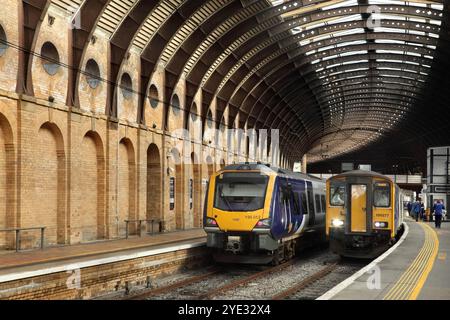 Northern Rail class 195 diesel multiple unit 195012, and class 150 number 150277, waiting at York station, UK. Stock Photo