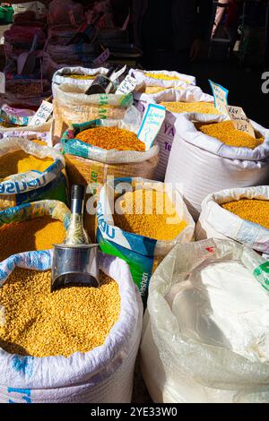 A display of open sacks of bulgur wheat for sale in Turkish market Foca Turkey Stock Photo