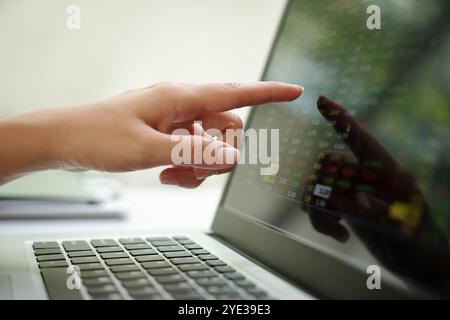 Analyzing Financial Data on Modern Laptop Screen Stock Photo