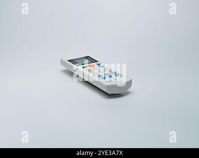 Old model remote control which is visible from its large shape, the condition of the cover is not clean. Used to turn on electronic equipment. Stock Photo