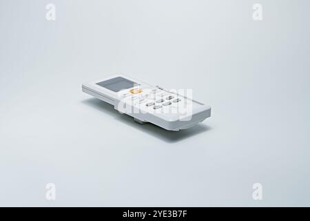Old model remote control which is visible from its large shape, the condition of the cover is not clean. Used to turn on electronic equipment. Stock Photo